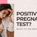 A young black woman looking at her positive pregnancy test, unsure of the next steps.