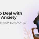 A woman sitting in a chair with her head in her hands, looking anxious, with the title "How to Deal with Fear & Anxiety After a Positive Pregnancy Test" displayed.