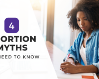 A woman in a blue shirt writes in a notebook while seated at a desk, with the text "4 Abortion Myths You Need to Know" overlayed on the graphic.